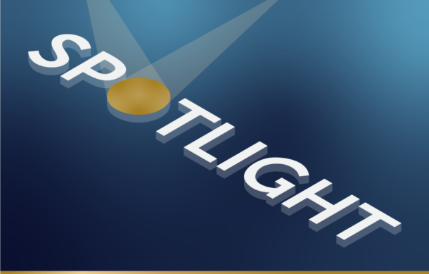 The word spotlight on a blue background with the 'o' as a spotlight circle